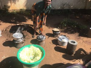 Woman cooking lunch for a team meeting at the Ministry of Hope